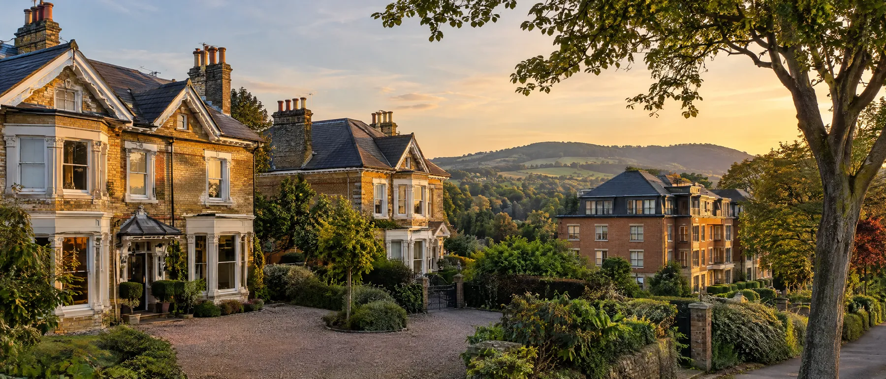 Victorian villas converted into apartments with the North Downs behind, Surrey