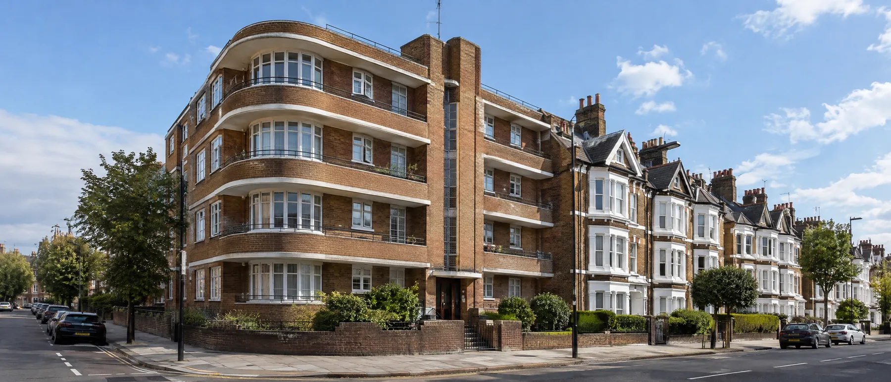 A 1930s purpose-built block of flats beside bay-fronted terraces in West London